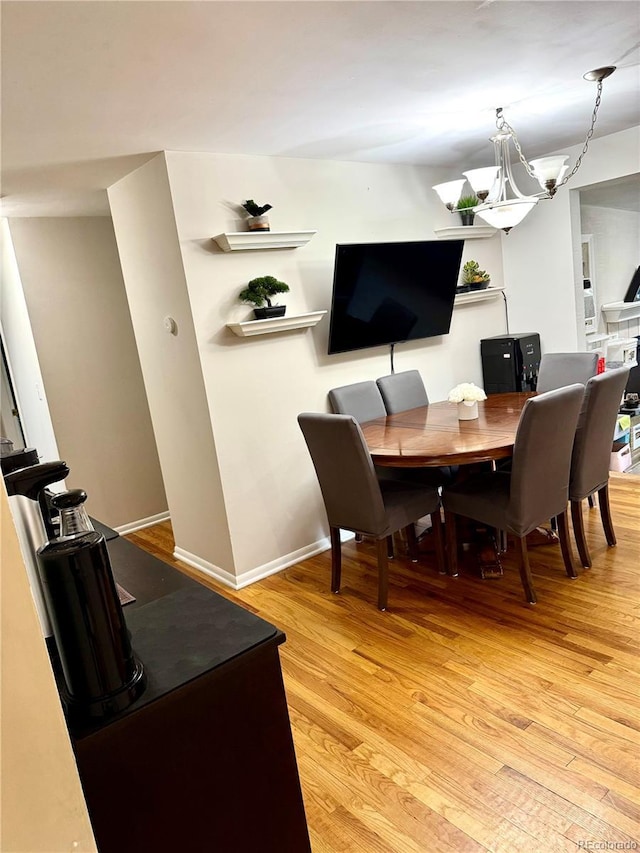 6616 S Lincoln St, Centennial, CO 80121 - dining space featuring light wood finished floors and a chandelier