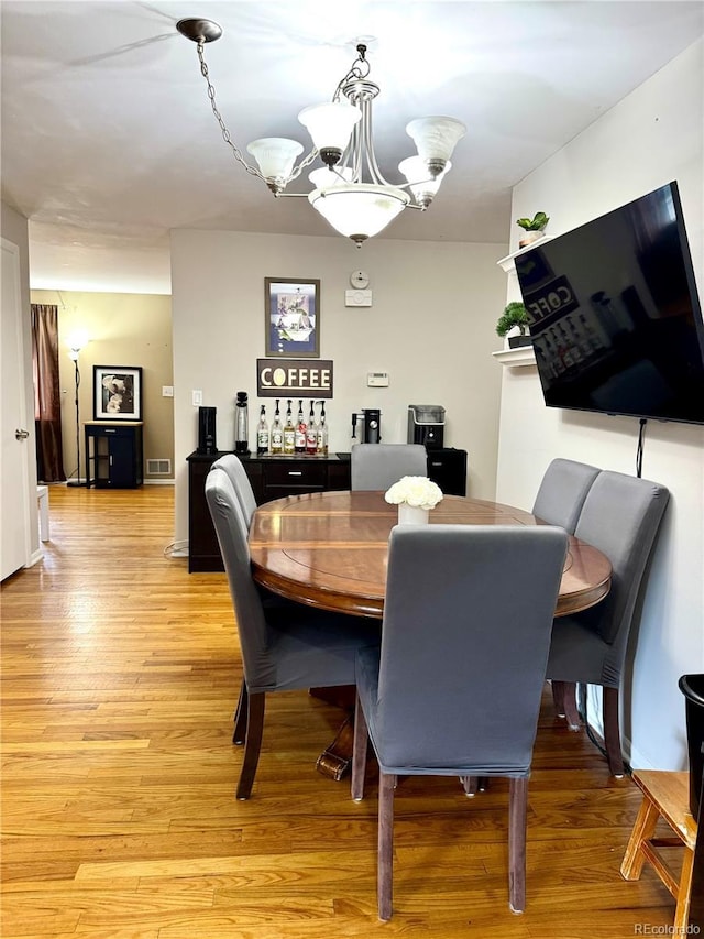 6616 S Lincoln St, Centennial, CO 80121 - dining space featuring a chandelier and light wood-style flooring