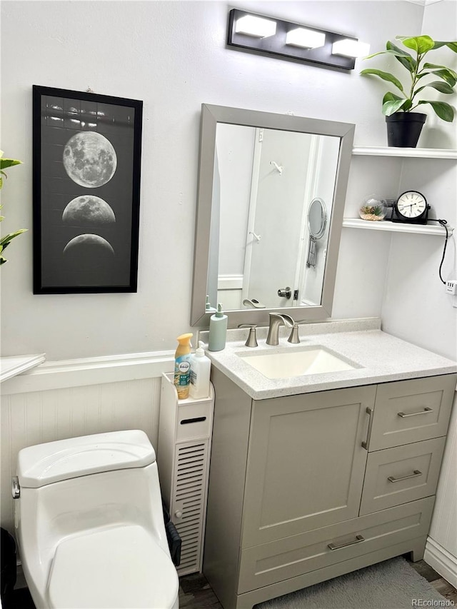6616 S Lincoln St, Centennial, CO 80121 - half bath featuring vanity and a wainscoted wall