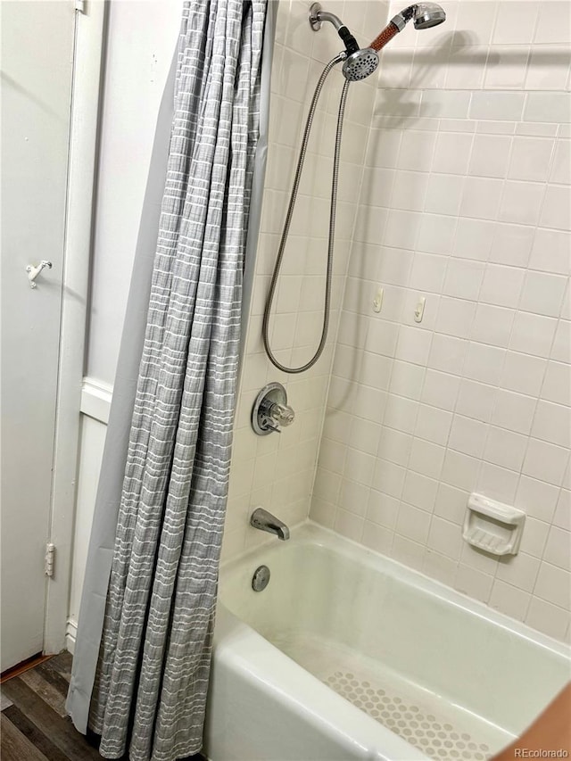 6616 S Lincoln St, Centennial, CO 80121 - bathroom featuring shower / bath combo and wood finished floors