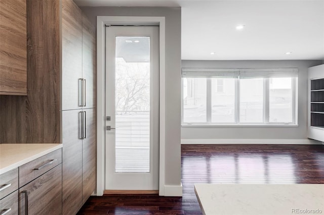 doorway to outside with dark hardwood / wood-style floors