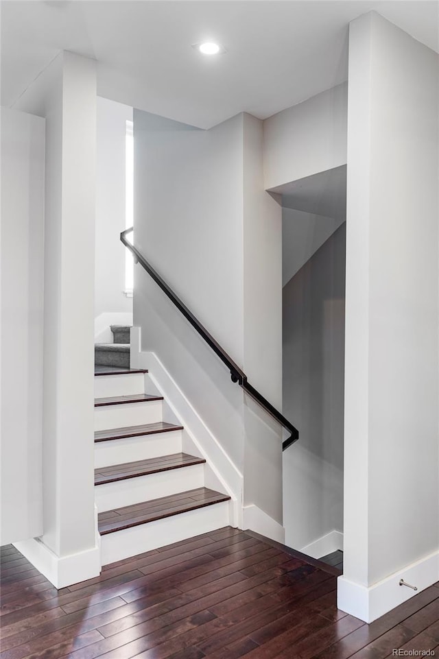 stairs with hardwood / wood-style floors