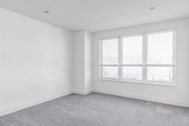 empty room featuring light colored carpet