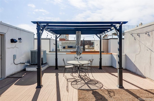 view of patio / terrace featuring central air condition unit, a pergola, and a wooden deck