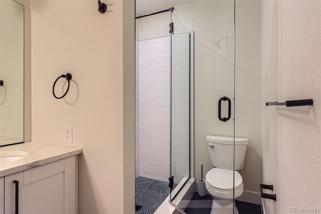 bathroom featuring toilet, walk in shower, and vanity