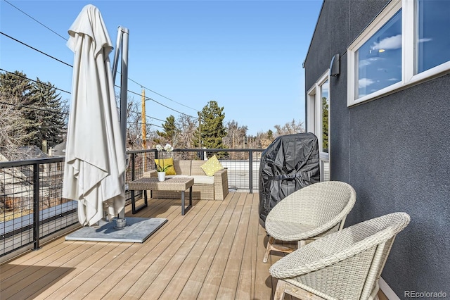 deck featuring outdoor lounge area