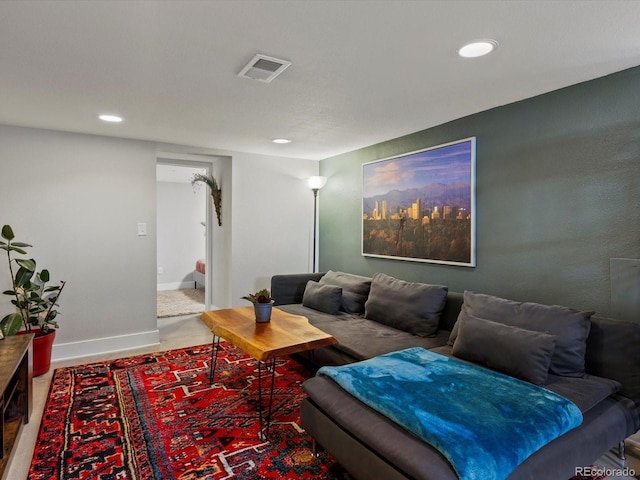 living room with recessed lighting and baseboards