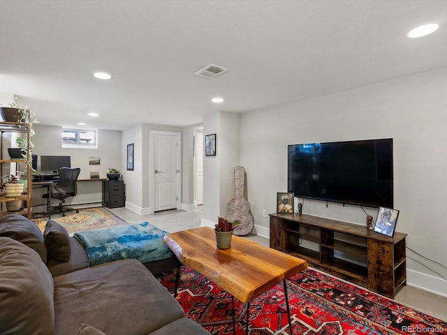 living room featuring an office area, recessed lighting, and baseboards