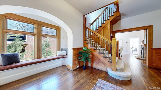 entrance foyer with plenty of natural light and dark wood-type flooring