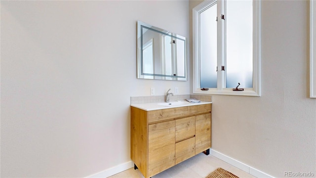 bathroom with tile flooring and vanity