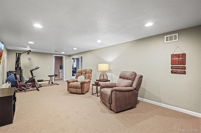 interior space with recessed lighting, visible vents, and a textured ceiling