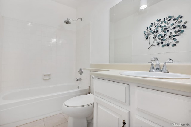 full bathroom featuring tile patterned floors, vanity, tiled shower / bath combo, and toilet