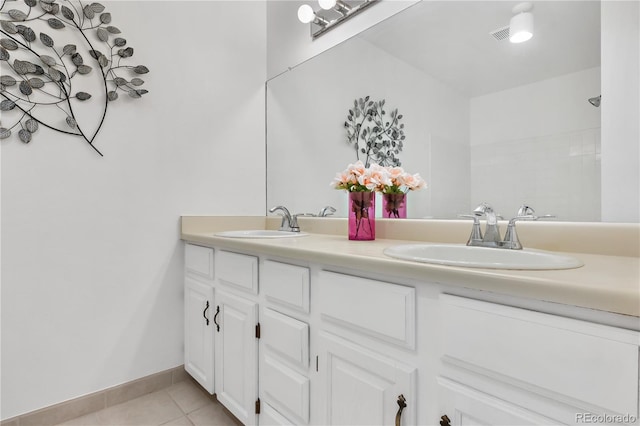 bathroom featuring tile patterned floors and vanity