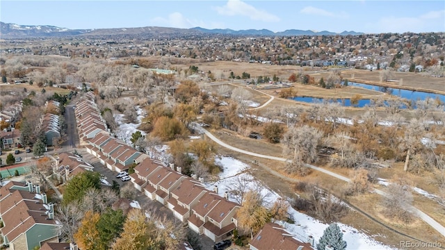 birds eye view of property featuring a water and mountain view