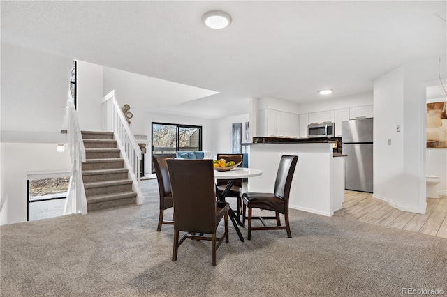 dining space featuring light hardwood / wood-style flooring