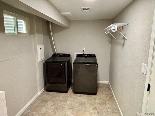 6895 W 84th Way Unit 4, Arvada, CO 80003 - laundry room featuring separate washer and dryer and baseboards