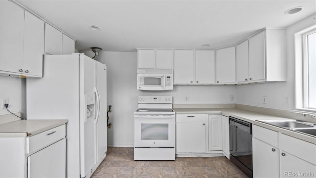 28571/2 Teller Ave, Grand Junction, CO 81501 - kitchen featuring white appliances, white cabinetry, and light countertops