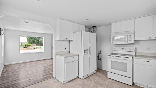 28571/2 Teller Ave, Grand Junction, CO 81501 - kitchen featuring white appliances, white cabinetry, and light countertops