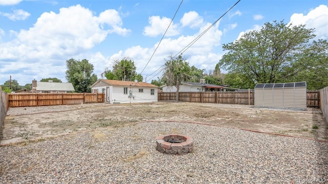 28571/2 Teller Ave, Grand Junction, CO 81501 - fenced backyard featuring an outdoor fire pit and a shed