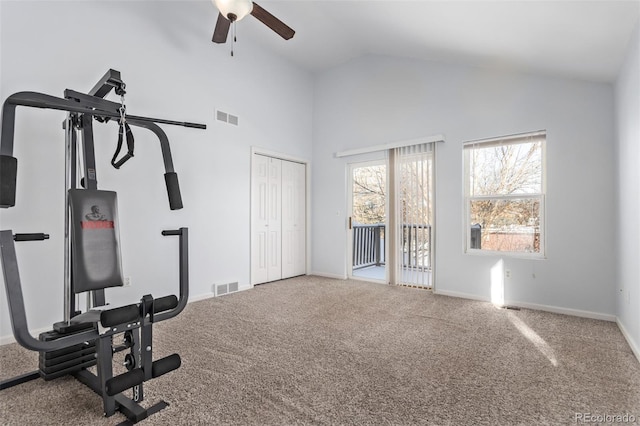 exercise room featuring carpet flooring, vaulted ceiling, and ceiling fan