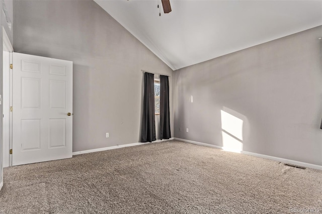 empty room with carpet, high vaulted ceiling, and ceiling fan