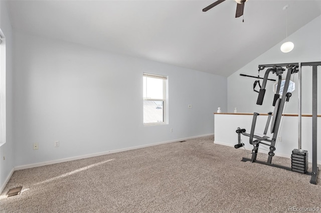 workout area featuring ceiling fan, carpet, and vaulted ceiling