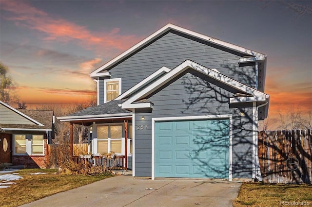 view of front facade with a porch and a garage