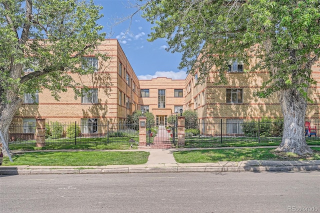 1523 Ivy St Unit 6, Denver, CO 80220 - view of building exterior featuring a fenced front yard