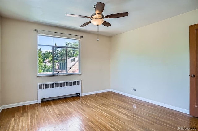 1523 Ivy St Unit 6, Denver, CO 80220 - empty room featuring radiator, ceiling fan, and wood-type flooring