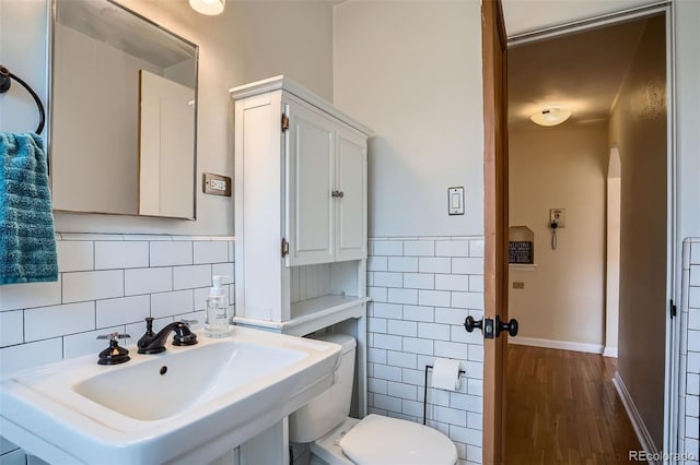 1523 Ivy St Unit 6, Denver, CO 80220 - bathroom with tile walls and wood finished floors