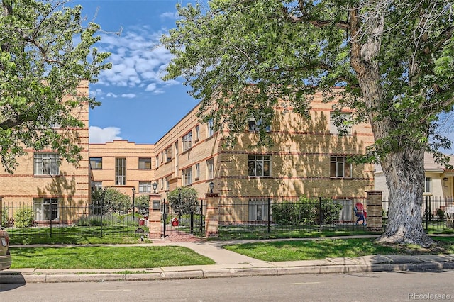 1523 Ivy St Unit 6, Denver, CO 80220 - view of building exterior with a fenced front yard