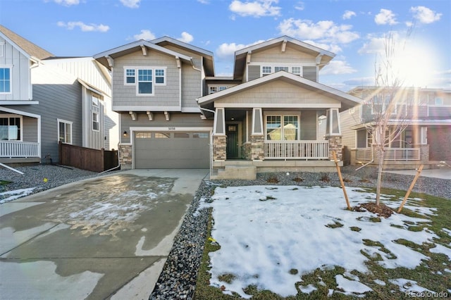 view of front of house featuring a porch and a garage