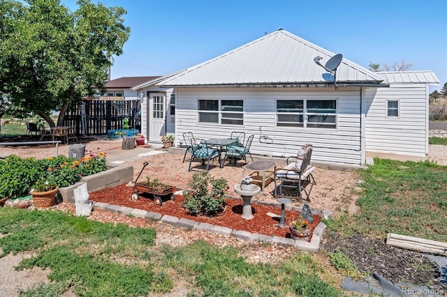 back of property featuring a patio