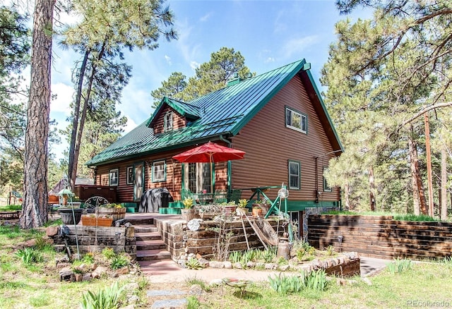5030 Cedar Way, Elizabeth, CO 80107 - back of house with a wooden deck, metal roof, a standing seam roof, and log exterior