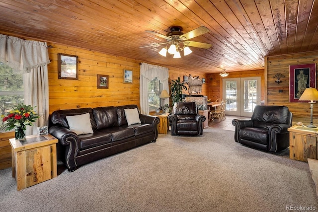 5030 Cedar Way, Elizabeth, CO 80107 - carpeted living area with wood ceiling, french doors, ceiling fan, and wood walls
