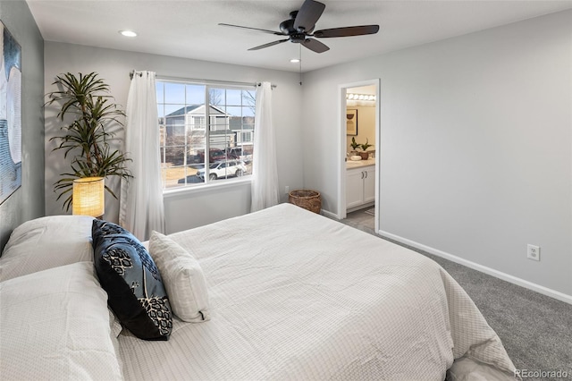 carpeted bedroom with ensuite bath, baseboards, a ceiling fan, and recessed lighting