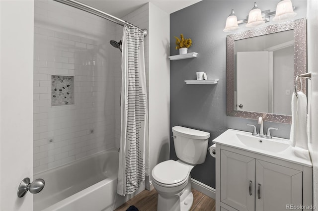 bathroom with baseboards, toilet, wood finished floors, shower / bath combo with shower curtain, and vanity