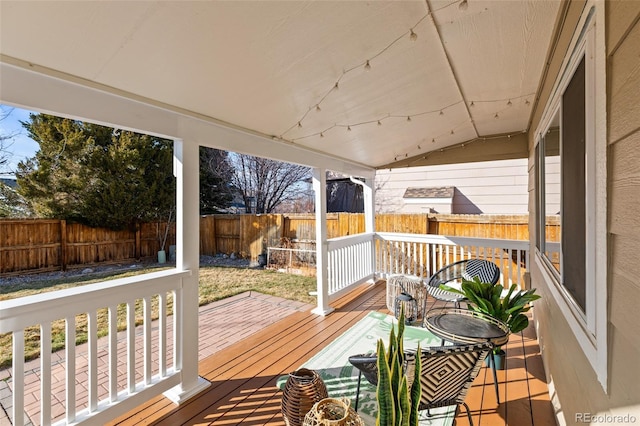 wooden deck featuring a fenced backyard