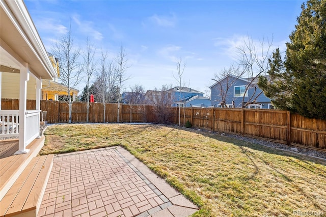 view of yard featuring a patio and a fenced backyard