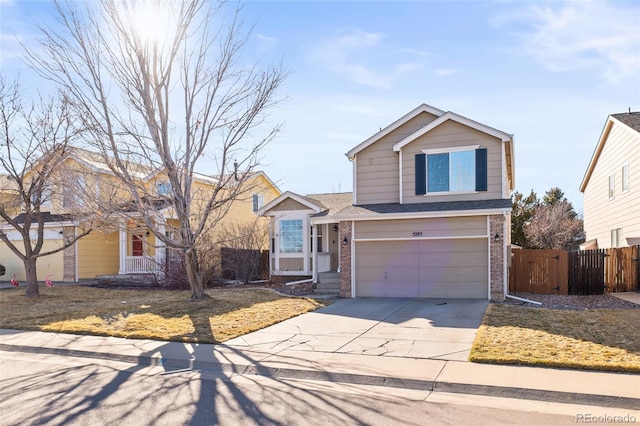 view of front of home featuring a garage, driveway, brick siding, and fence