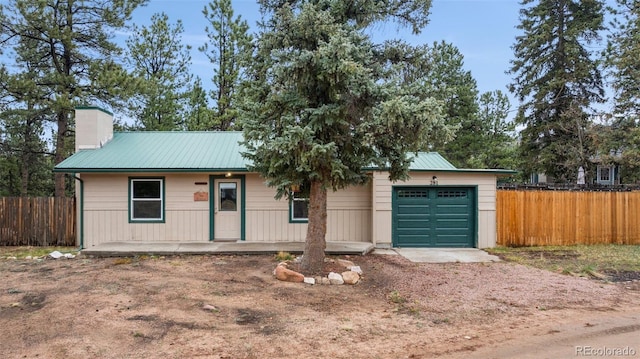 281 Mesa Dr, Florissant, CO 80816 - ranch-style house featuring dirt driveway, fence, and metal roof