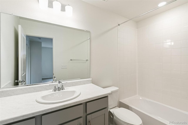 full bath featuring toilet, vanity, and shower / bath combination
