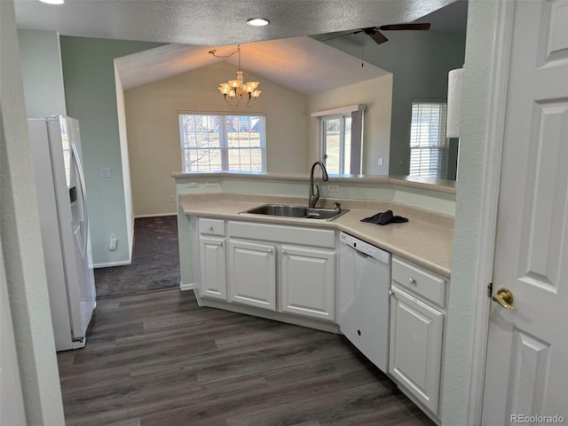 kitchen featuring light countertops, white appliances, a sink, and white cabinets