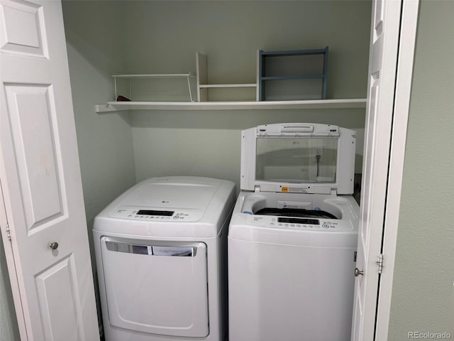 laundry area with laundry area and independent washer and dryer