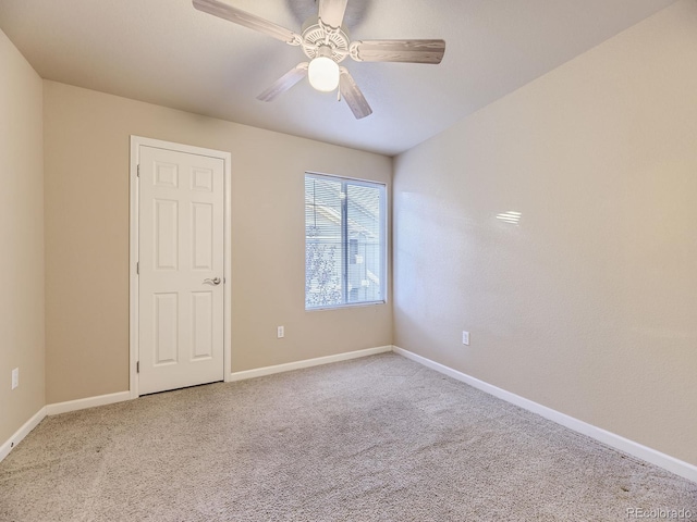 carpeted empty room with ceiling fan