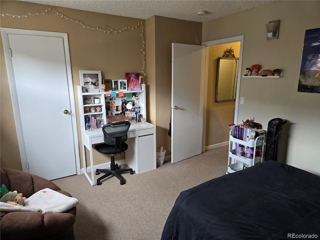 carpeted bedroom featuring a textured ceiling