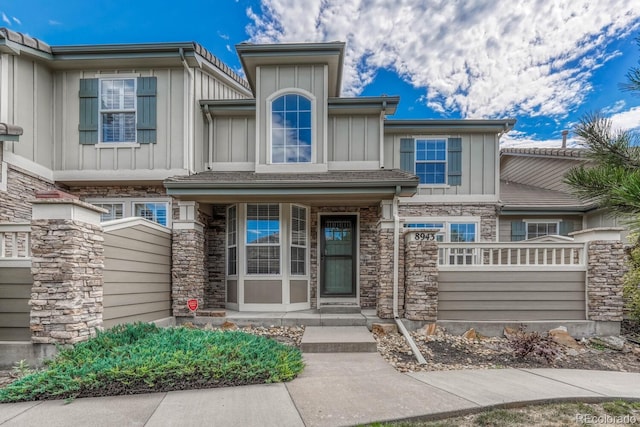8943 Tappy Toorie Cir, Highlands Ranch, CO 80129 - entrance to property with board and batten siding and stone siding