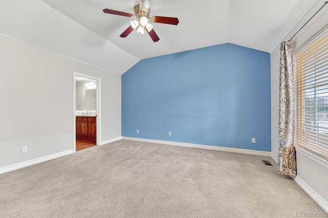 8943 Tappy Toorie Cir, Highlands Ranch, CO 80129 - carpeted spare room featuring ceiling fan, lofted ceiling, and baseboards
