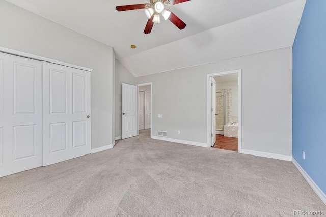 8943 Tappy Toorie Cir, Highlands Ranch, CO 80129 - unfurnished bedroom with carpet, lofted ceiling, baseboards, a closet, and connected bathroom