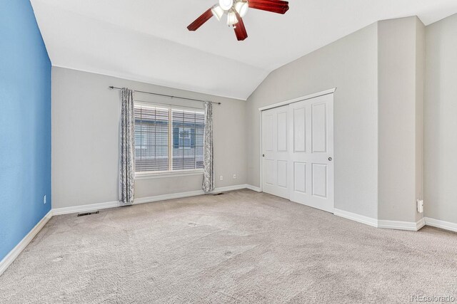 8943 Tappy Toorie Cir, Highlands Ranch, CO 80129 - unfurnished bedroom with vaulted ceiling, carpet flooring, baseboards, and a ceiling fan